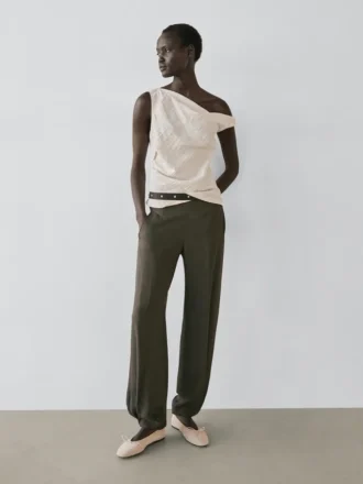 Asymmetrisk topp med knutdetalj