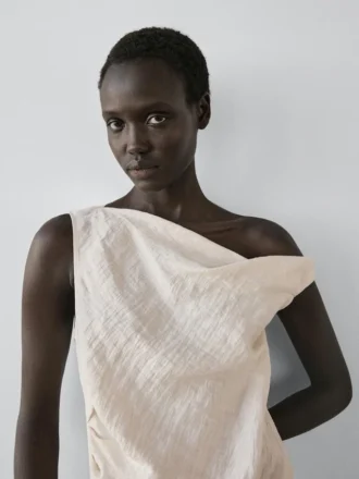 Asymmetrisk topp med knutdetalj