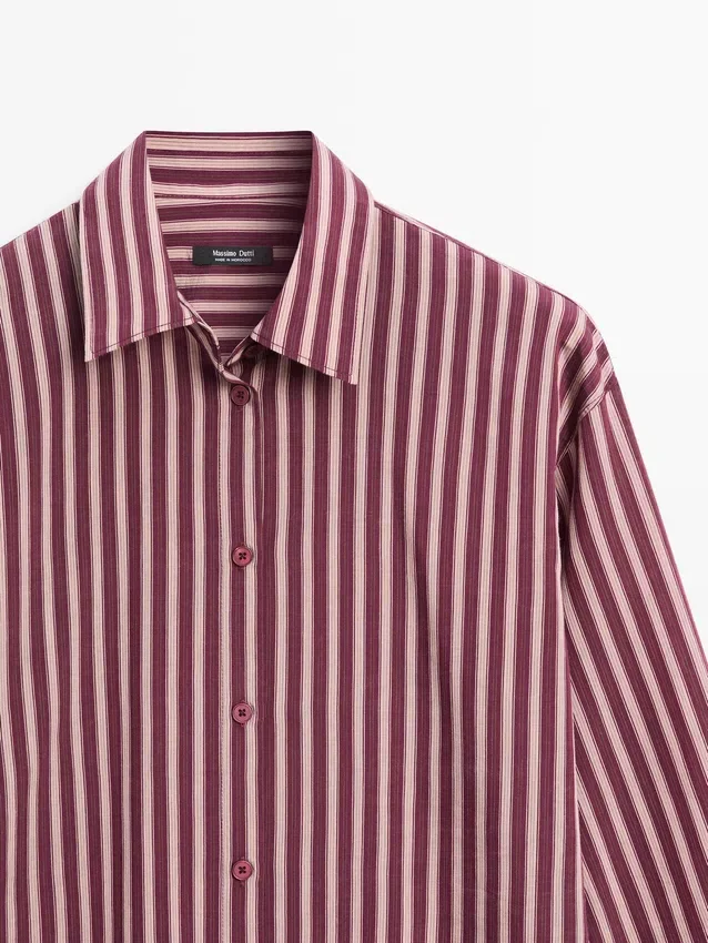 Flödande skjorta med randiga detaljer Flödande skjorta med randiga detaljer