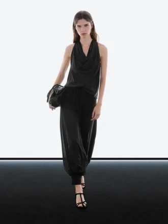 Halvtransparenta sarouelbyxor med knappdetaljer