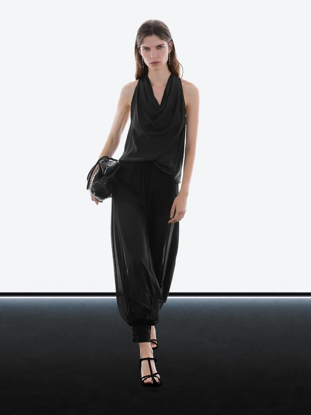 Halvtransparenta sarouelbyxor med knappdetaljer Halvtransparenta sarouelbyxor med knappdetaljer