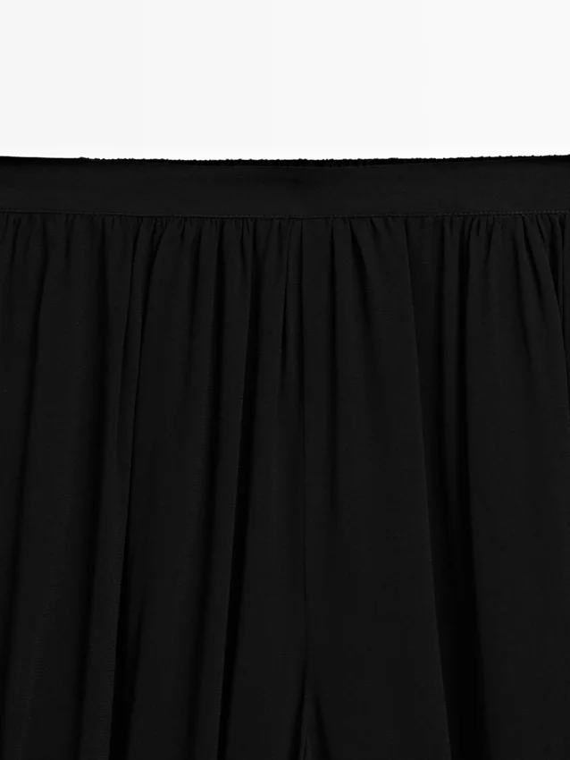 Halvtransparenta sarouelbyxor med knappdetaljer Halvtransparenta sarouelbyxor med knappdetaljer