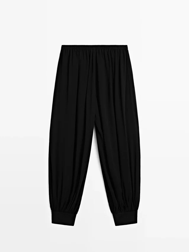 Halvtransparenta sarouelbyxor med knappdetaljer Halvtransparenta sarouelbyxor med knappdetaljer