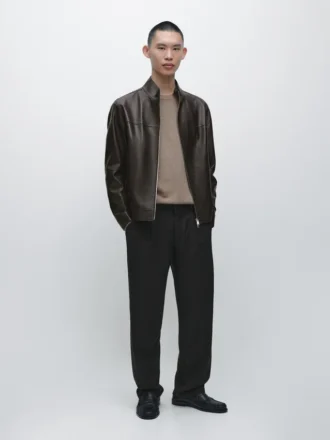 Jacka i nappaläder med sliten effekt