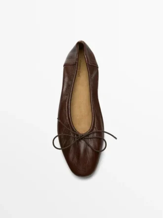 Rynkade ballerinaskor med rosett