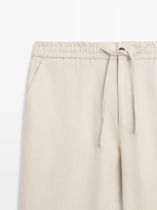 Total Look-byxor i linne med detalj i midjan Total Look-byxor i linne med detalj i midjan